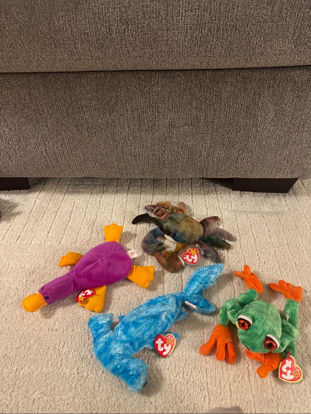 Odd beanie babies flat lay Plush Frog, Platypus, crab and sea animal